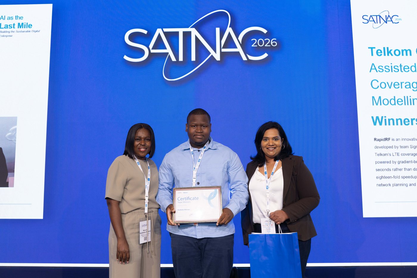 SATNAC 2026 team on stage with the award