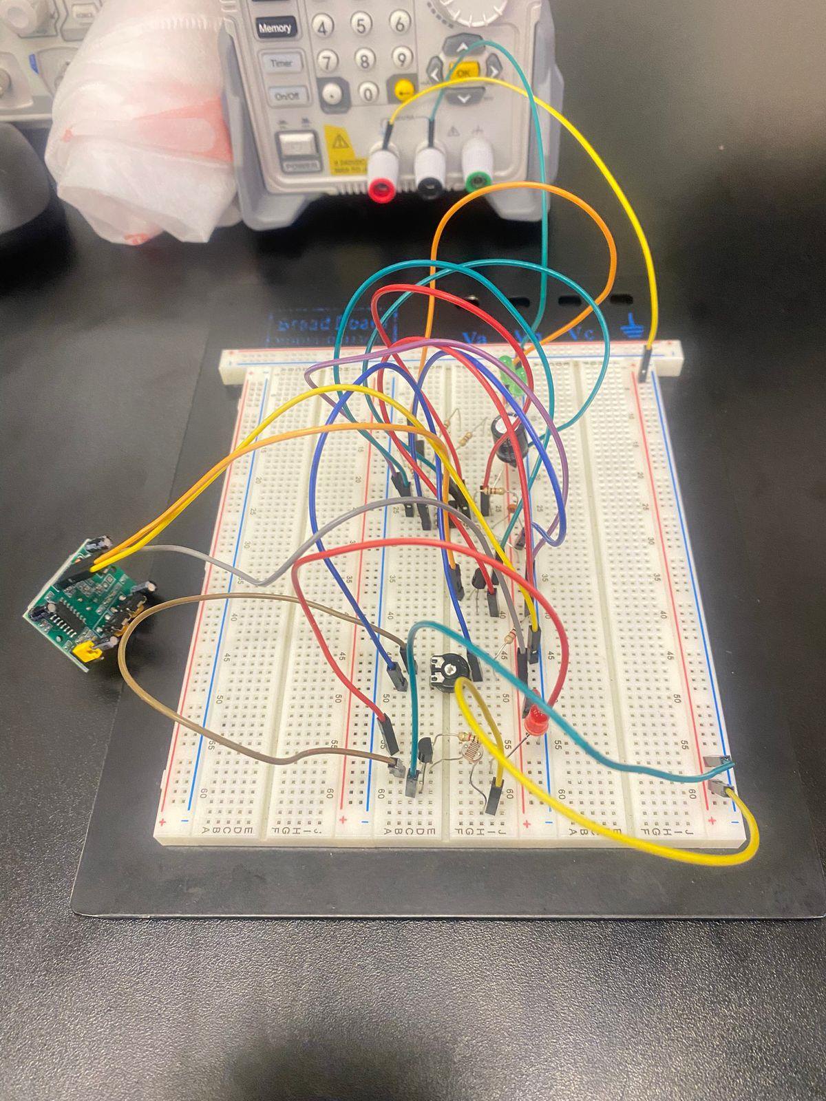 Assembled darkness-activated motion detector
